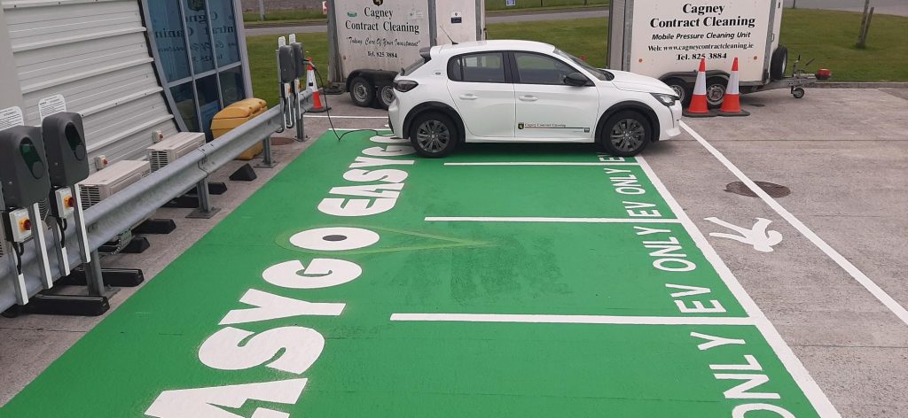 White electric car pictured at the new EasyGo charging points at Cagney Cleaning