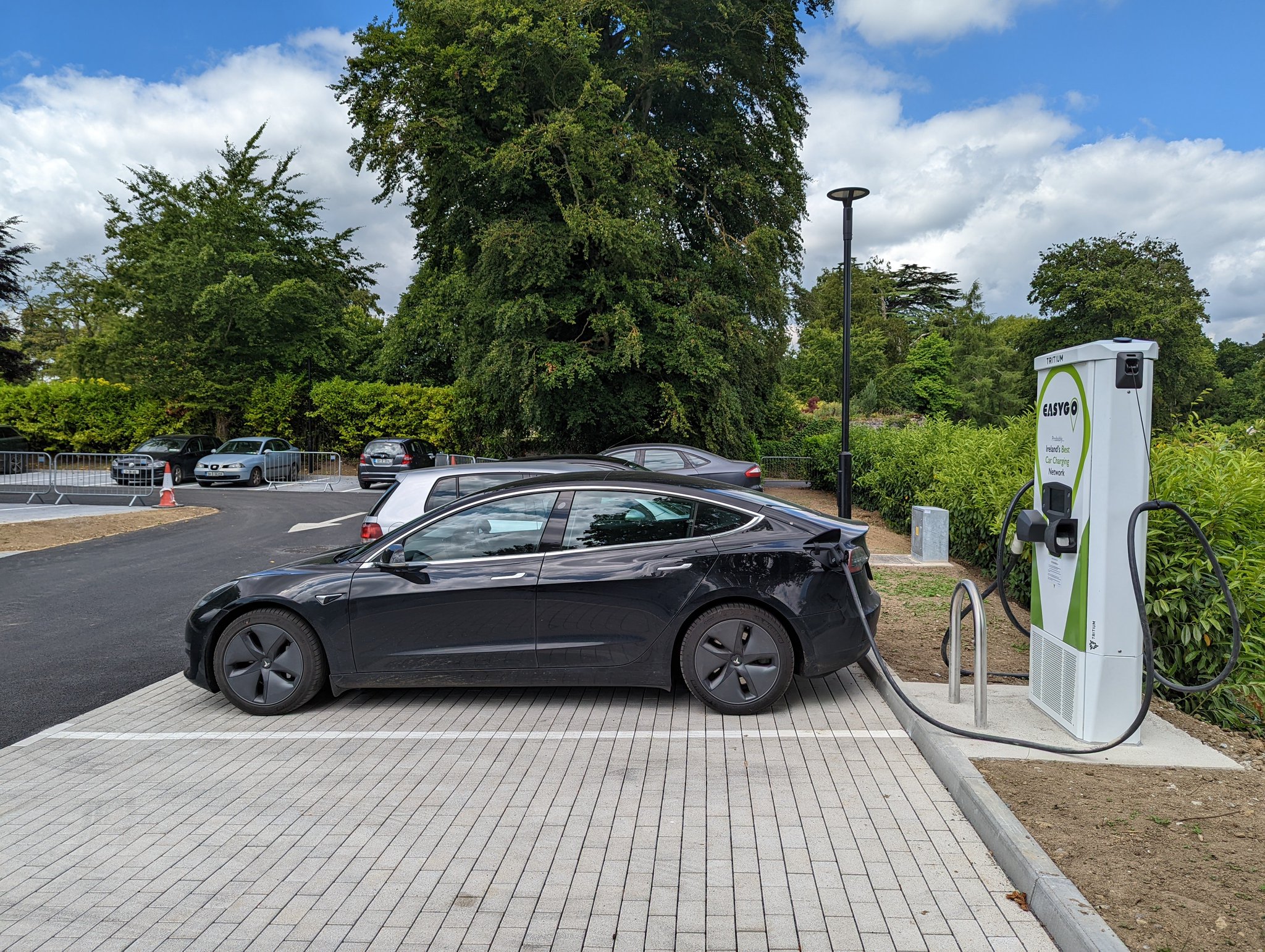 Tesla charging at EasyGo rapid DC electric vehicle charger at Mount Juliet Estate