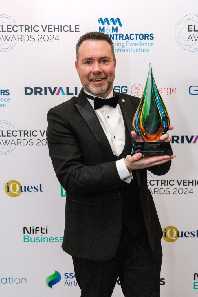 EasyGo Founder and CEO Chris Kelly with his award at the Electric Vehicle Awards 2024